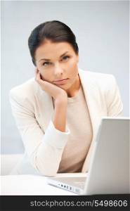 picture of pensive woman with laptop computer