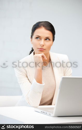 picture of pensive woman with laptop computer