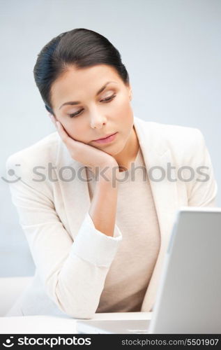 picture of pensive woman with laptop computer.