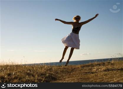 picture of pretty blonde jumping