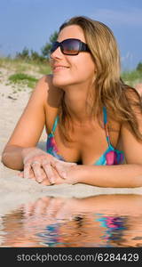 picture of pretty girl relaxing on the beach