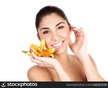 Picture of pretty woman holding in hand fresh yellow lily yellow flower, closeup portrait of girl with perfect skin isolated on white background, enjoying dayspy, luxury beauty salon, spa concept