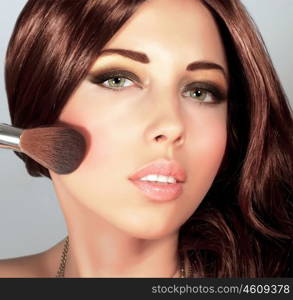 Picture of pretty woman with stylish makeup, cute girl holding brush for blush, sexy female with gloss brown hair, fashionable beauty salon, luxury lifestyle, perfect complexion, New Year party