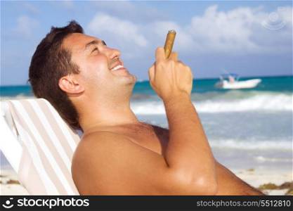 picture of relaxed man with cigar on the beach