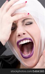 picture of screaming wounded woman face over grey