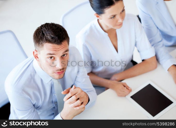 picture of serious businessman on meeting in office