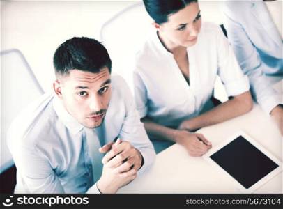 picture of serious businessman on meeting in office