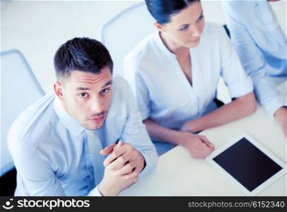 picture of serious businessman on meeting in office. serious businessman on meeting in office