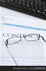 picture of signed contract paper with glasses