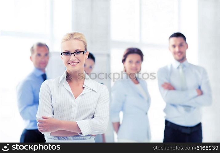 picture of smiling attractive businesswoman in office. businesswoman in office