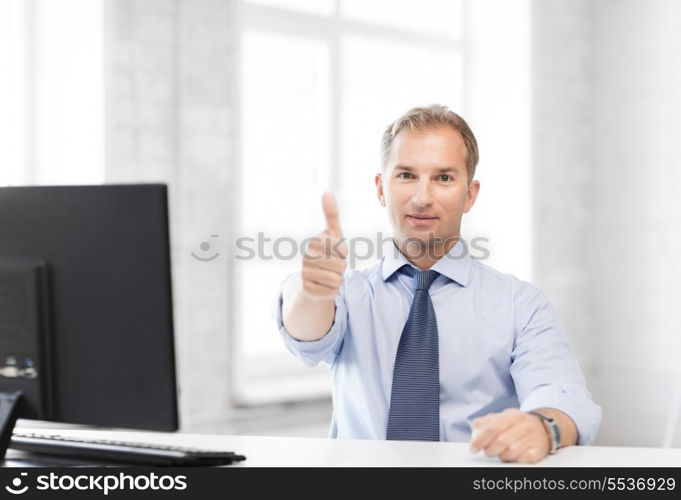 picture of smiling businessman showing thumbs up