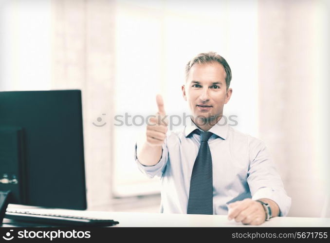 picture of smiling businessman showing thumbs up