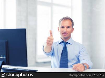 picture of smiling businessman showing thumbs up. smiling businessman showing thumbs up