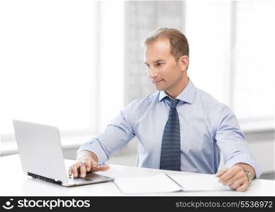 picture of smiling businessman working in office