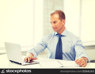 picture of smiling businessman working in office