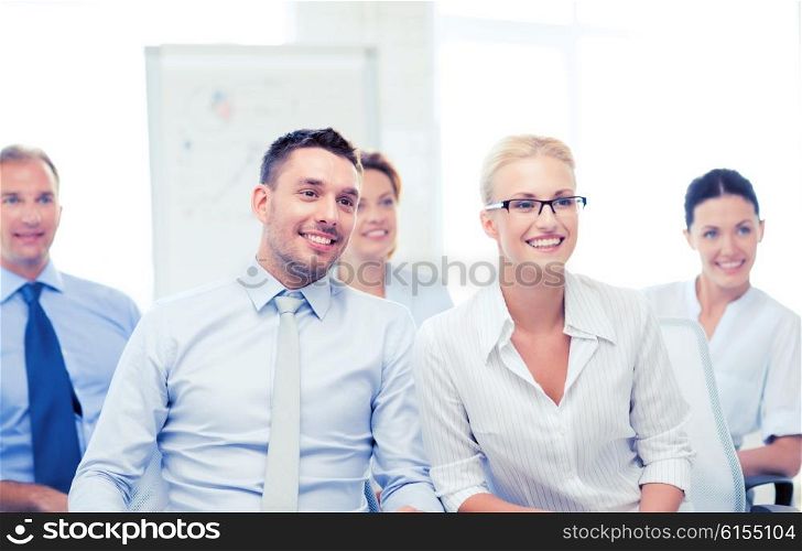 picture of smiling businessmen and businesswomen on conference. businessmen and businesswomen on conference