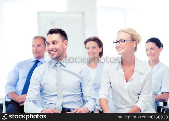 picture of smiling businessmen and businesswomen on conference. businessmen and businesswomen on conference