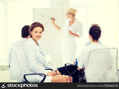 picture of smiling businesswoman on business meeting in office