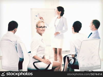 picture of smiling businesswoman on business meeting in office