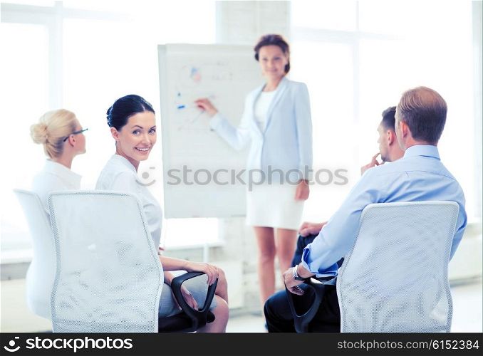 picture of smiling businesswoman on business meeting in office. businesswoman on business meeting in office
