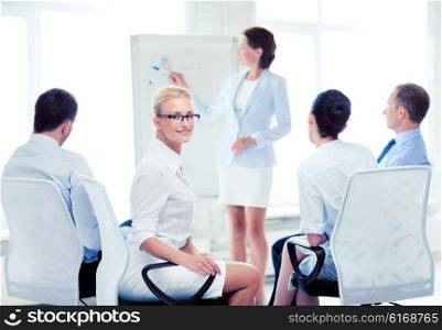 picture of smiling businesswoman on business meeting in office. businesswoman on business meeting in office