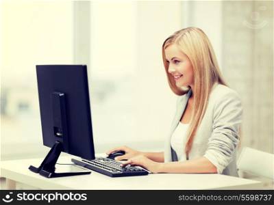picture of smiling businesswoman using her computer