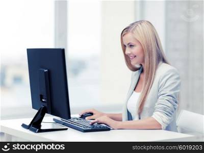 picture of smiling businesswoman using her computer. businesswoman with computer