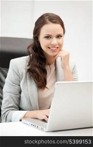picture of smiling businesswoman using her laptop computer