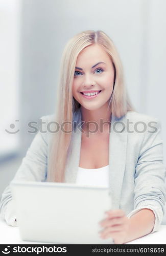 picture of smiling businesswoman using her laptop computer. businesswoman with laptop