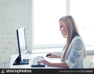 picture of smiling businesswoman with computer in office. businesswoman with computer in office