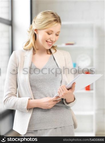 picture of smiling businesswoman with documents