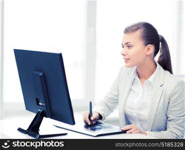 picture of smiling businesswoman with drawing tablet in office. businesswoman with drawing tablet in office