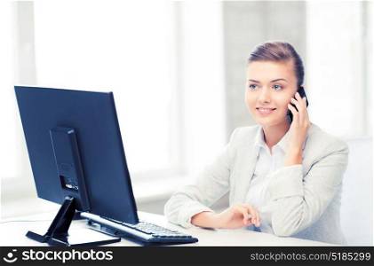 picture of smiling businesswoman with smartphone in office. businesswoman with smartphone in office