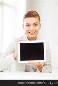 picture of smiling businesswoman with tablet pc in office