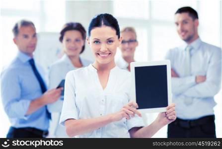 picture of smiling businesswoman with tablet pc in office. businesswoman with tablet pc in office