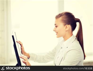 picture of smiling businesswoman with touchscreen in office
