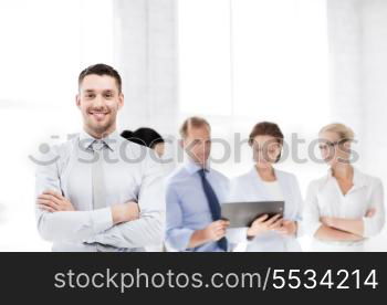 picture of smiling handsome businessman in office