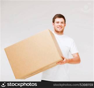 picture of smiling man carrying carton box