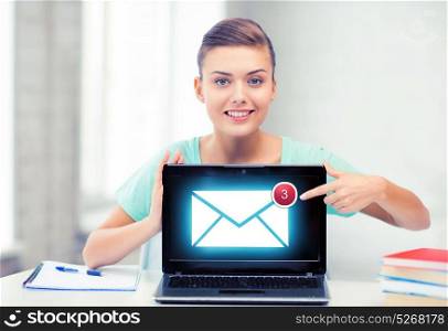 picture of smiling student girl with laptop at school. smiling student girl with laptop at school