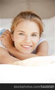 picture of smiling teenage girl on a bed