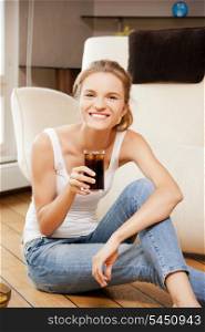 picture of smiling teenage girl with chips and coke
