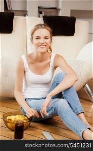 picture of smiling teenage girl with remote control