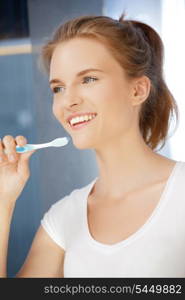 picture of smiling teenage girl with toothbrush