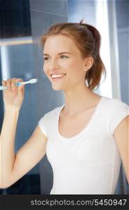 picture of smiling teenage girl with toothbrush