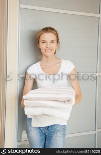 picture of smiling teenage girl with towels