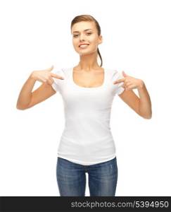 picture of smiling woman pointing at blank white t-shirt