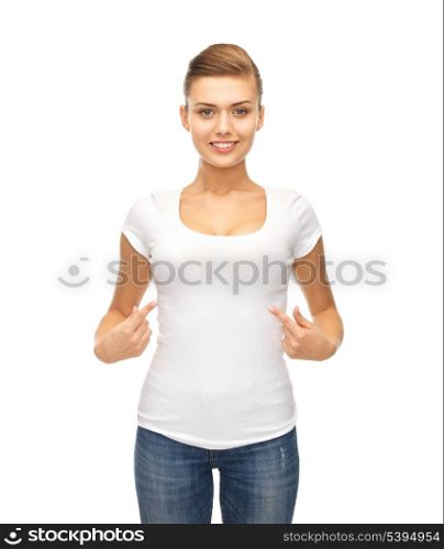 picture of smiling woman pointing at blank white t-shirt