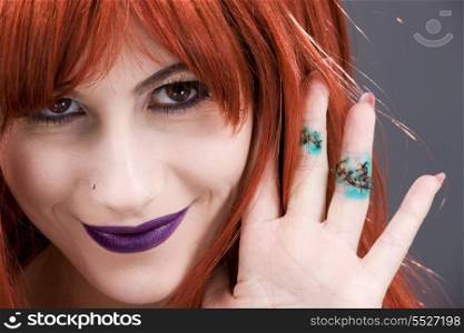 picture of smiling woman showing stitches on fingers