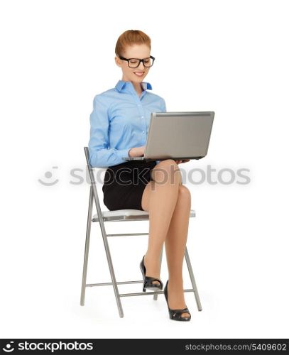 picture of smiling woman using her laptop computer