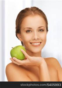 picture of smiling woman with an apple